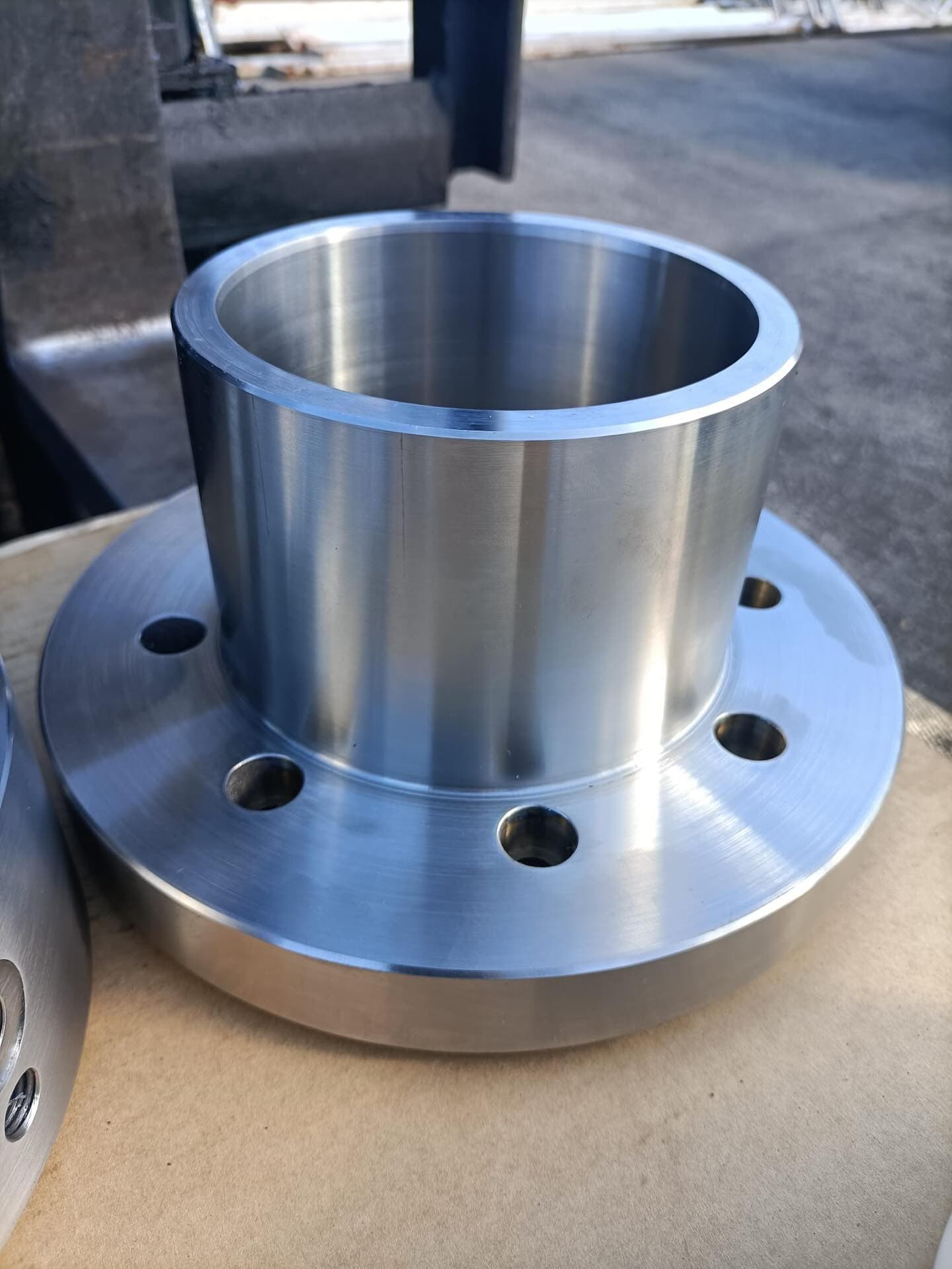 Stainless steel flange with machined integral hub and bored centre made by JWB Engineering